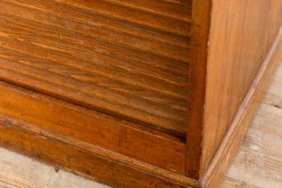 vintage wooden tambour cupboard corner shutter close up